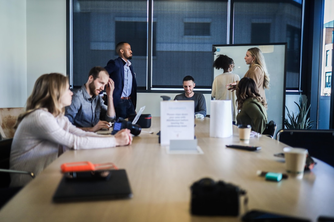 Professionals collaborating around a table in a modern office